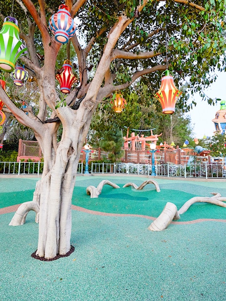 Colorful lanterns hanging from a tree in CenToonial Park, Disneyland Park California.