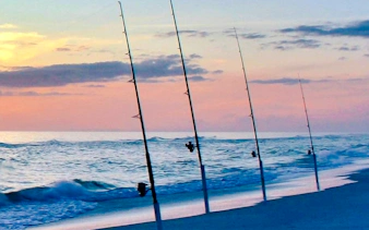 Fishing rods on the Atlantic shore at sunset in Oualidia, Essaouira.