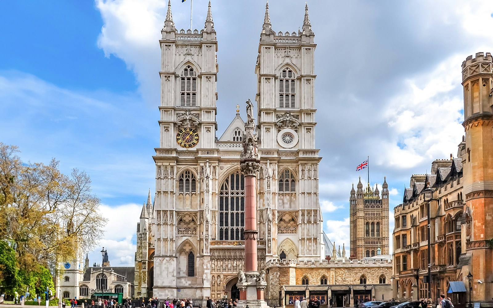 Westminster Abbey facade with towers and clock, London.