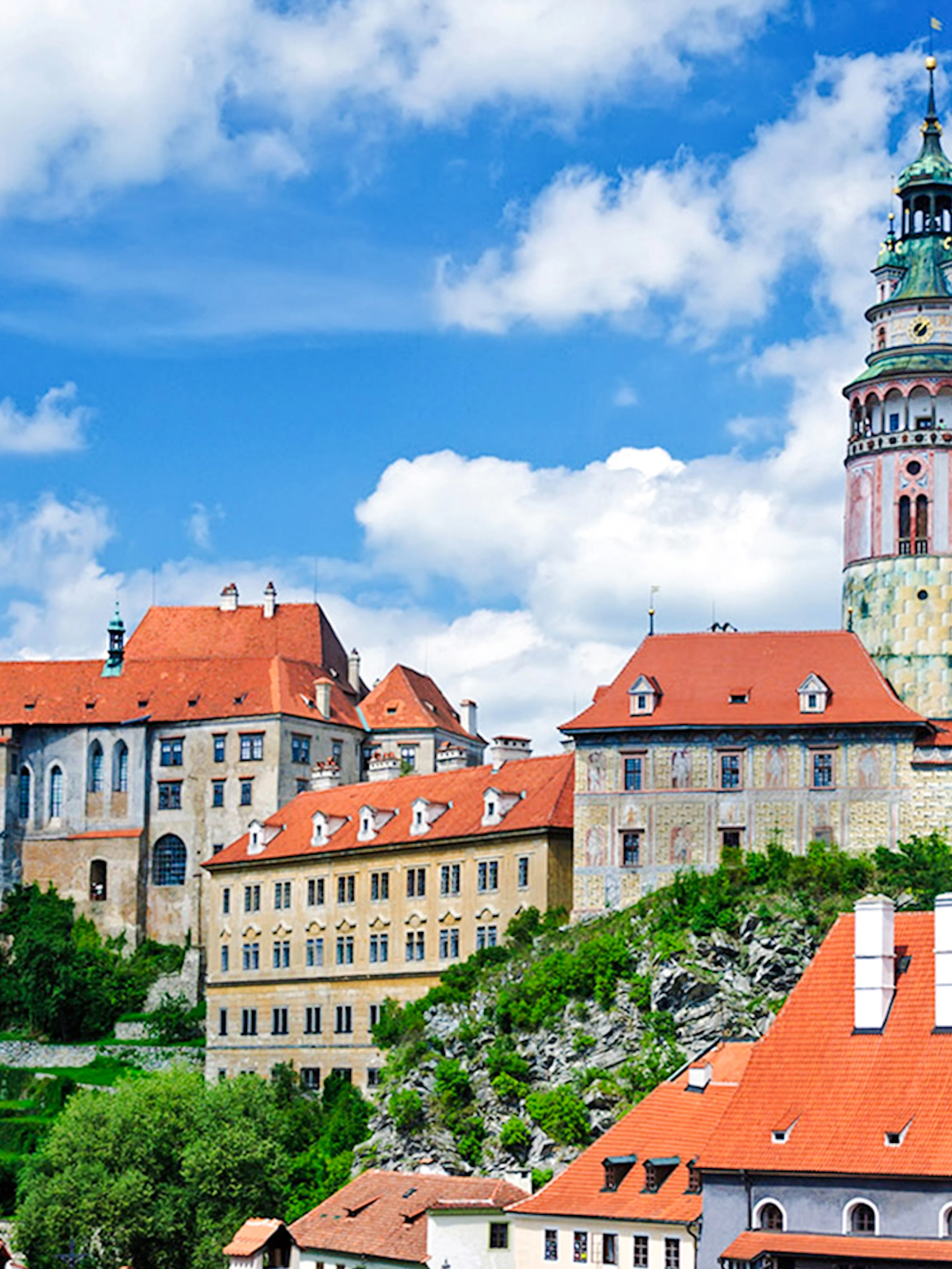 Český Krumlov Castle with red rooftops and tower, Czech Republic.