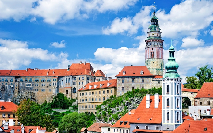 Český Krumlov Castle with red rooftops and tower, Czech Republic.