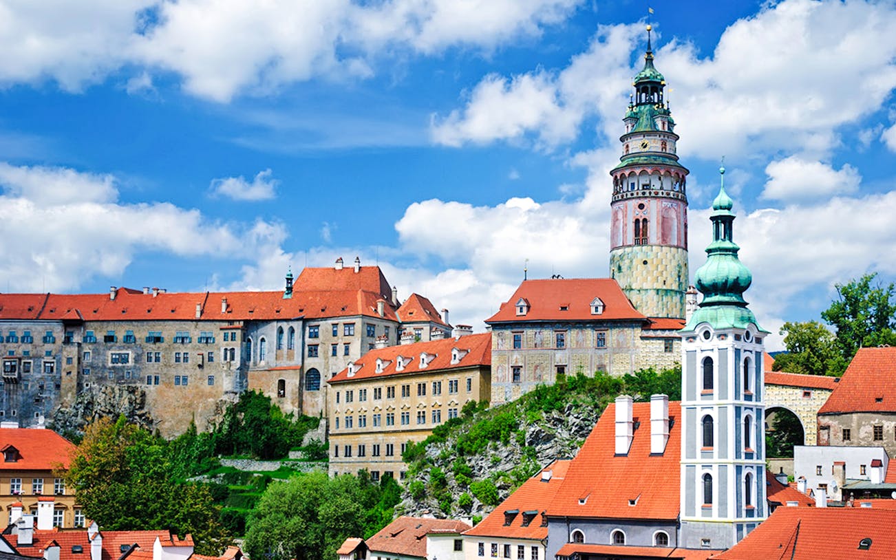 Český Krumlov Castle with red rooftops and tower, Czech Republic.