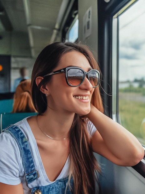 Traveler enjoying scenic view on Naples train tour.