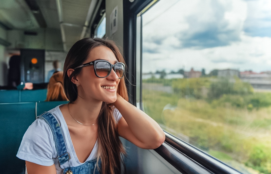 Traveler enjoying scenic view on Naples train tour.