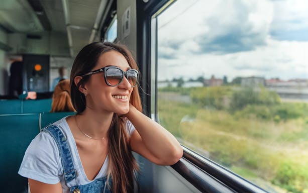 Naples train tour with scenic view of Mount Vesuvius and lush countryside.