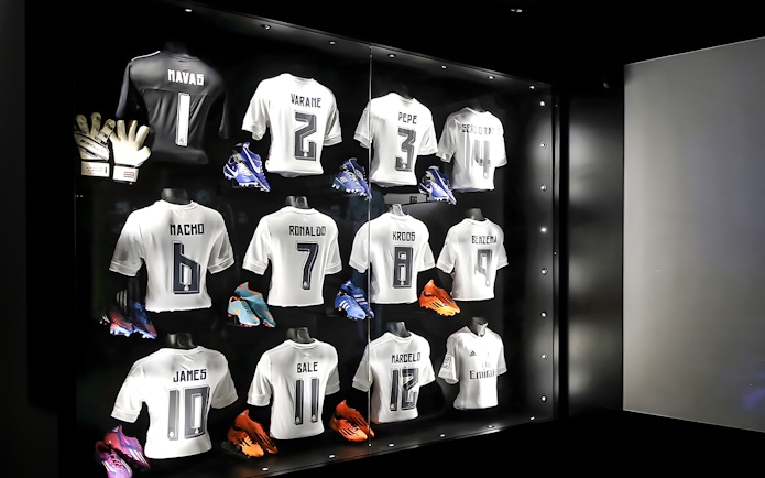 Jerseys and shoes on display at Santiago Bernabeu Stadium.