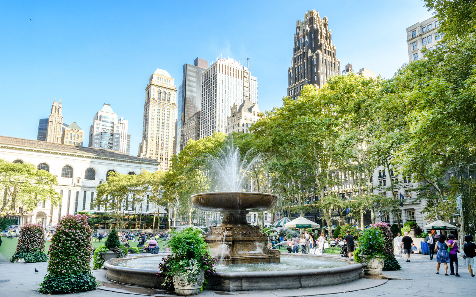 Fountain in Bryant Park with Manhattan skyline, New York.