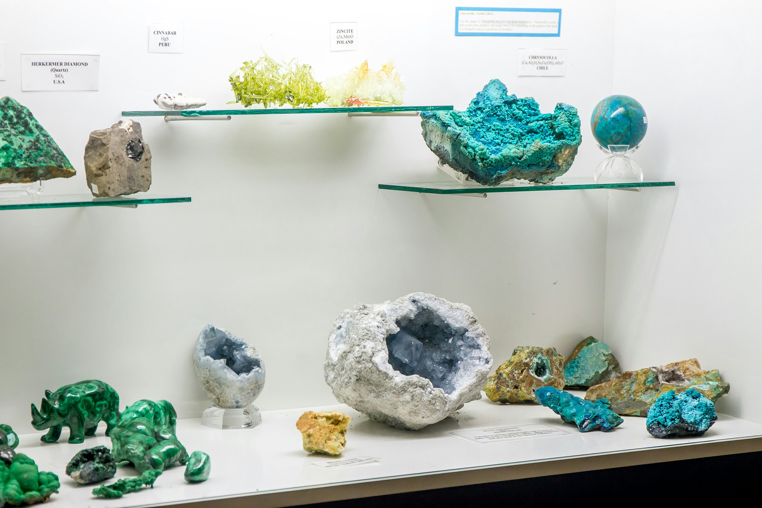 Gems and minerals exhibit at American National History Museum showcasing colorful crystals and stones.