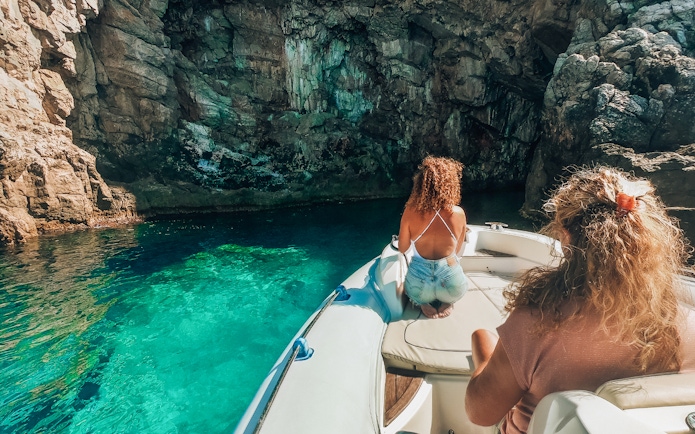 Private boat tour near Blue Cave, Dubrovnik, with passengers enjoying the view.