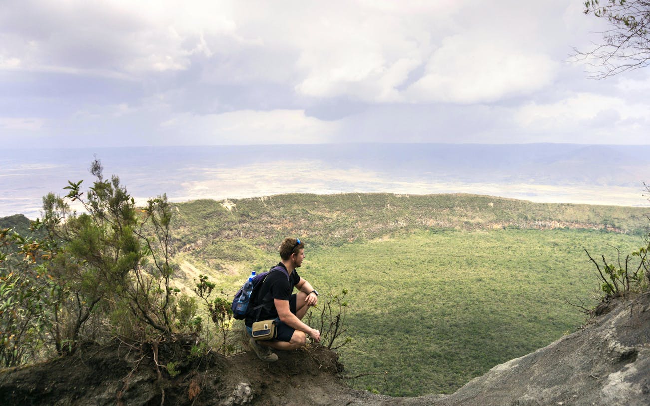 Person overlooking Mount Longonot crater, Maai Mahiu, near Nairobi.