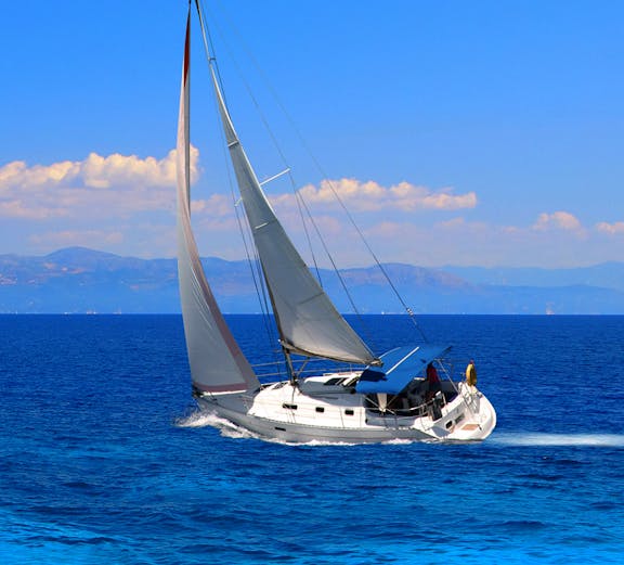 Sailing yacht on the Aegean Sea during a Santorini cruise.