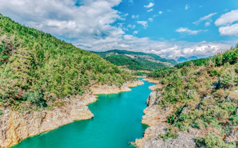 Dim Cay river winding through lush green hills near Alanya, Turkey.