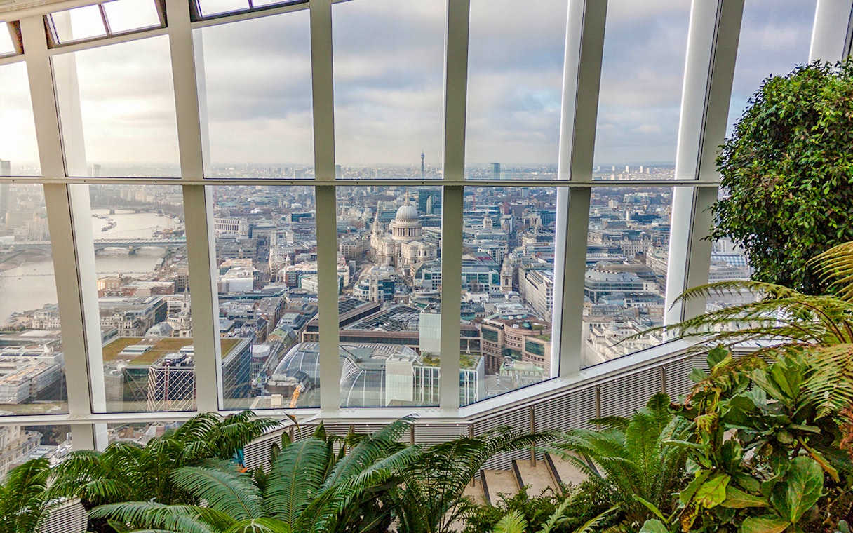 View of London skyline from Sky Garden with St. Paul's Cathedral visible.