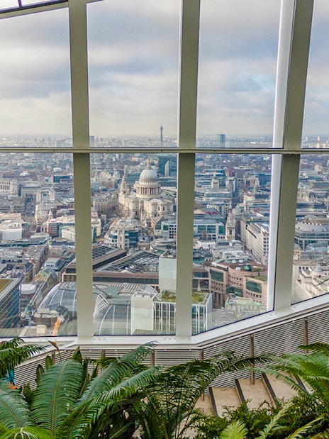View of London skyline from Sky Garden with St. Paul's Cathedral visible.