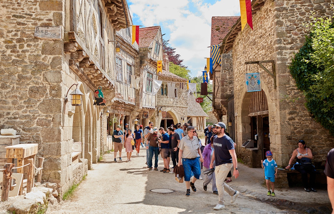 Puy du Fou France historical reenactment with actors in period costumes.