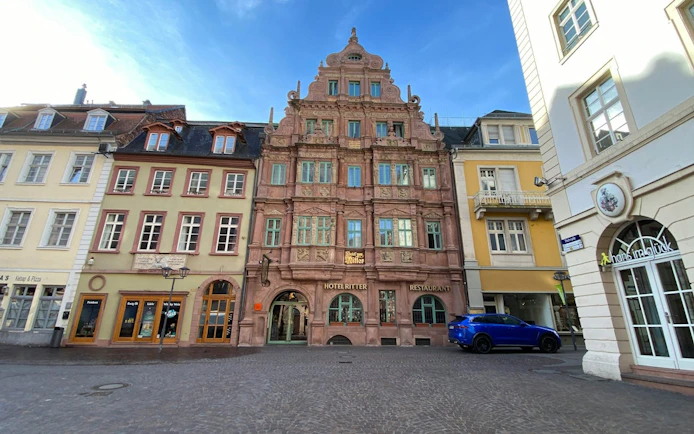 Historic Hotel Ritter facade in Heidelberg city center, part of self-guided exploration game.