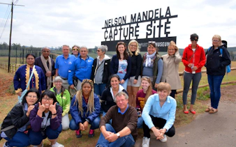Group of tourists at Nelson Mandela Capture Site in South Africa.