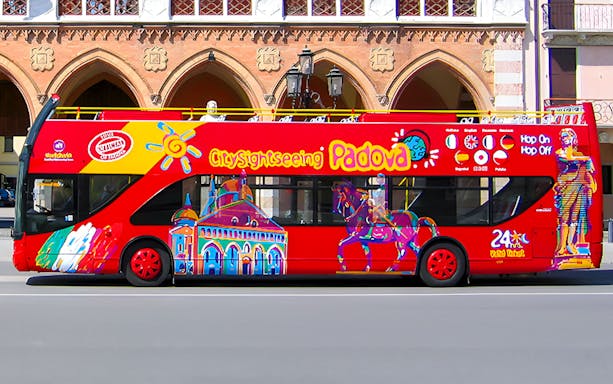 Hop-on hop-off tour bus in Padua with colorful city landmarks.