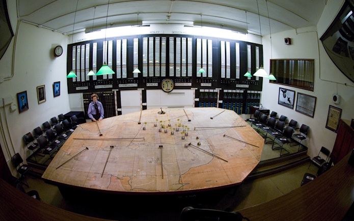 War room map table at Churchill's War Rooms, London, with historical displays and seating.