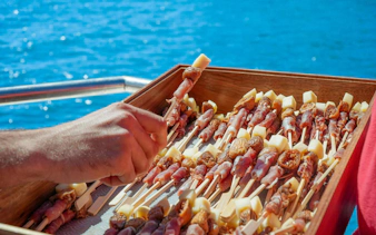 Prosciutto and cheese skewers served on a boat during Vilamoura brunch tour in Algarve.