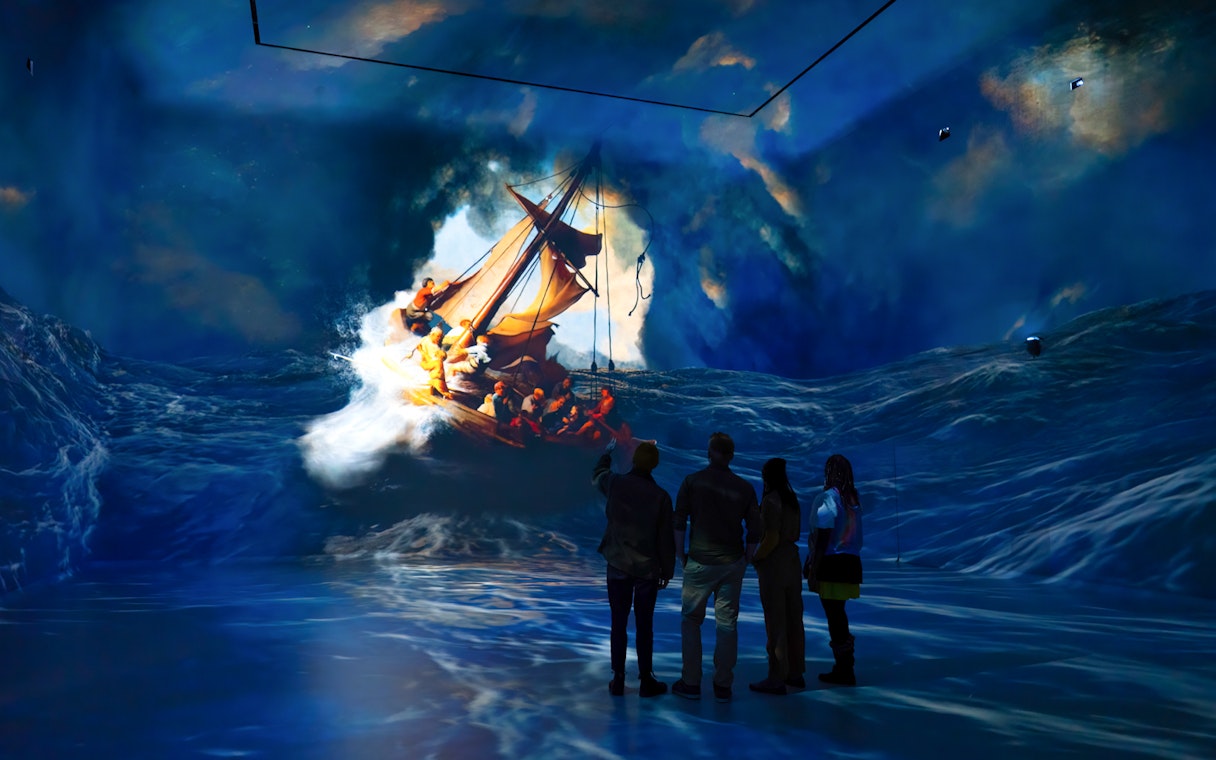 Visitors viewing immersive ocean art installation at Frameless London.