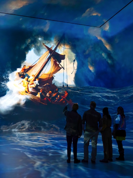 Visitors viewing immersive ocean art installation at Frameless London.