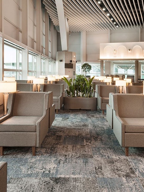 Plaza Premium Lounge seating area in Schengen Area Departures Terminal 1, Fiumicino Airport.