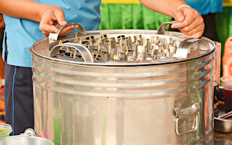 Traditional Thai ice cream being prepared on Mae Ping River Cruise.