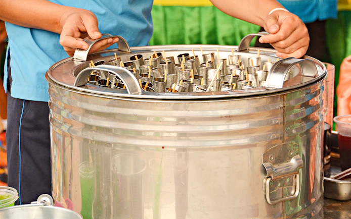Traditional Thai ice cream being prepared on Mae Ping River Cruise.