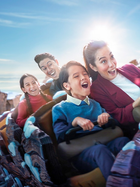 Families enjoying a roller coaster ride at Genting SkyWorld Outdoor Theme Park.