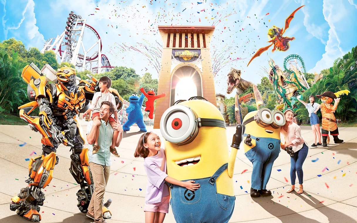 Universal Studios entrance with characters and attractions, featuring Minions and roller coasters.