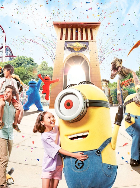 Universal Studios entrance with characters and attractions, featuring Minions and roller coasters.