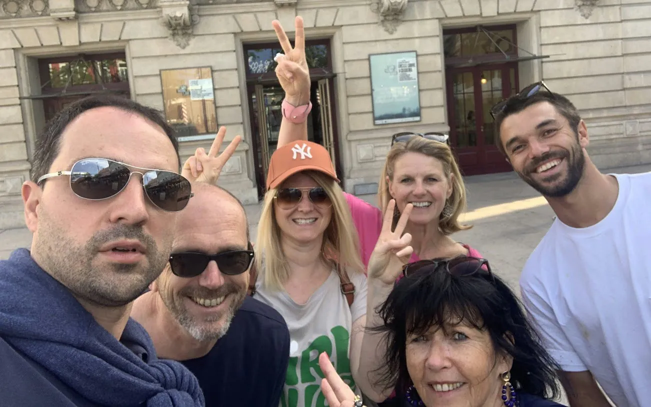 Group of tourists enjoying Porto’s Old Town exploration game.