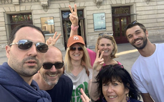 Group of tourists enjoying Porto’s Old Town exploration game.