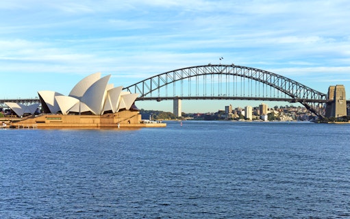 Sydney Opera House and Harbour Bridge viewed from the water during Captain Cook Rocket Sightseeing tour.