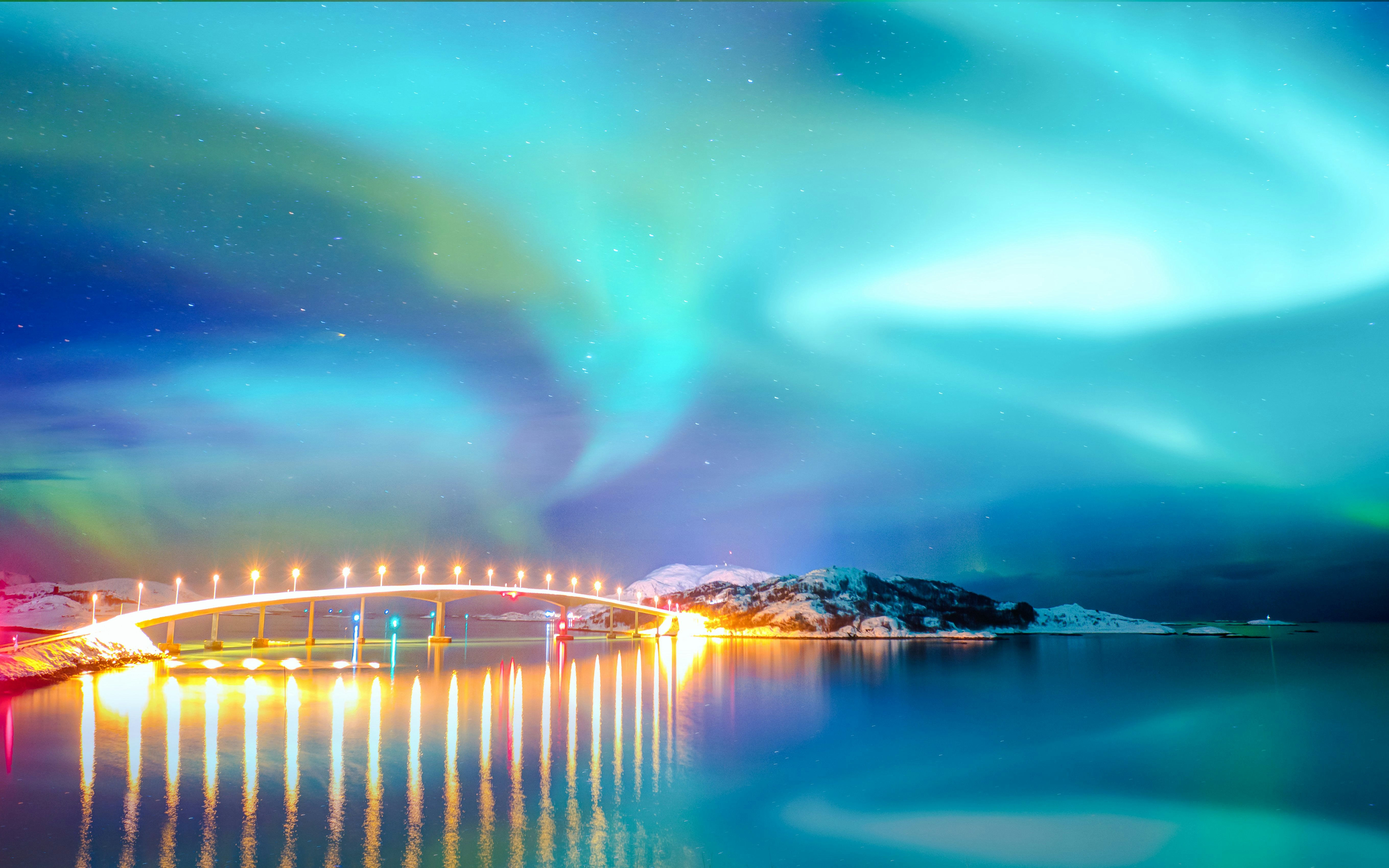 Tromso Bridge under Northern Lights in Norway.