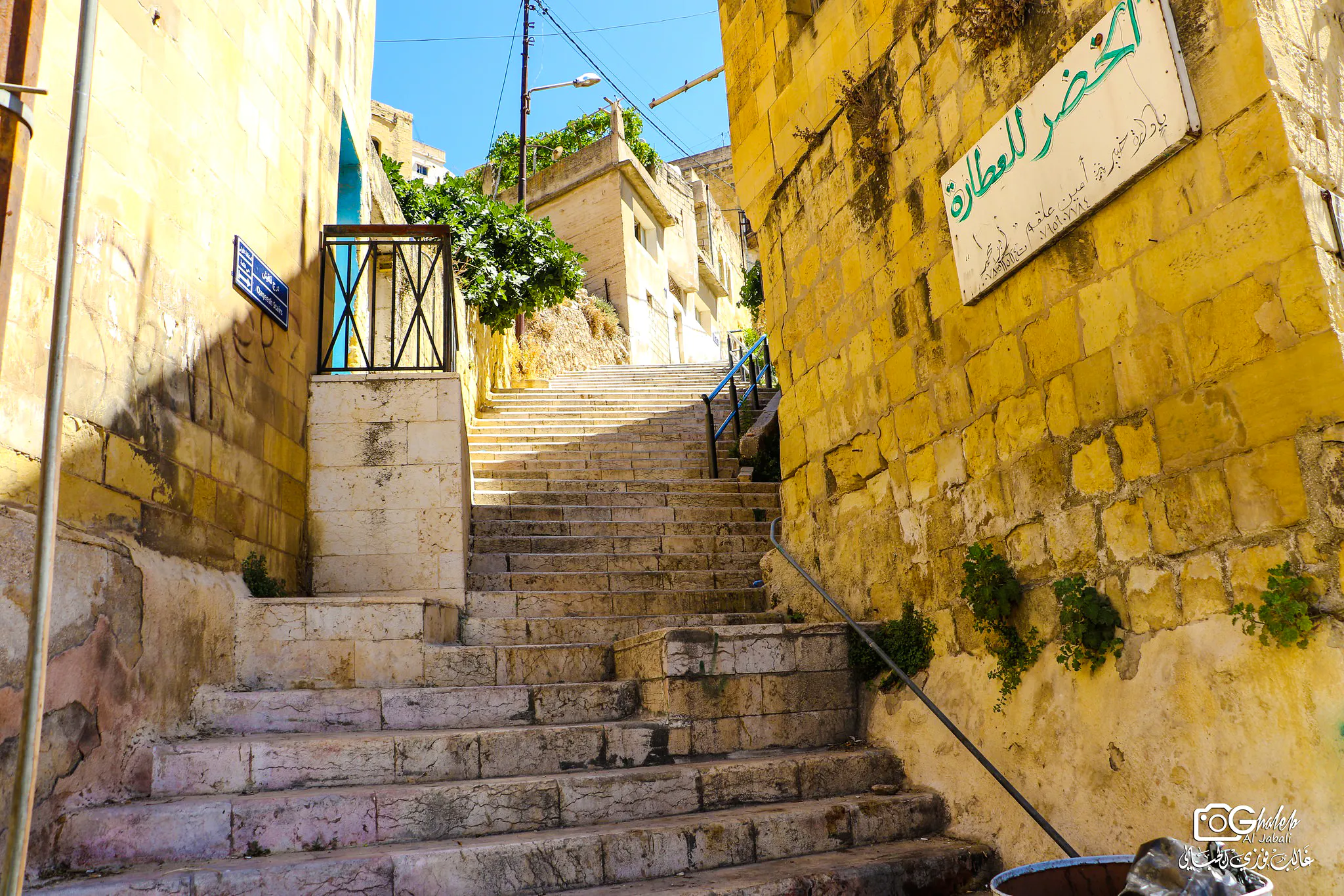 Stone staircase in As-Salt, Jordan, leading through historic buildings on the Harmony Trail.