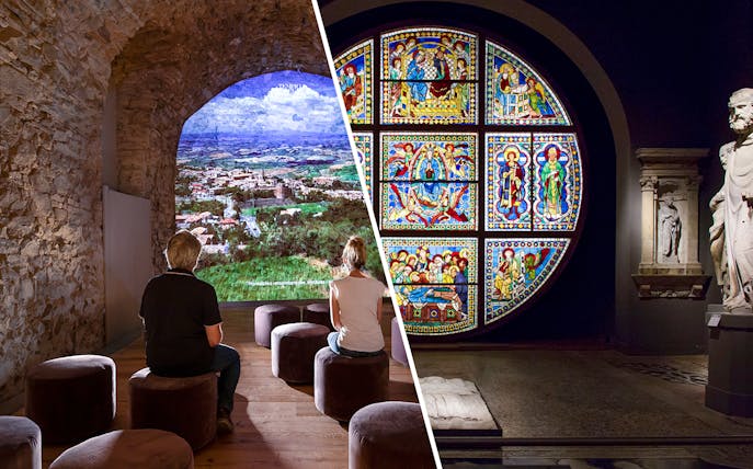 Visitors viewing Siena landscape and stained glass art in Val D'Orcia exhibit.