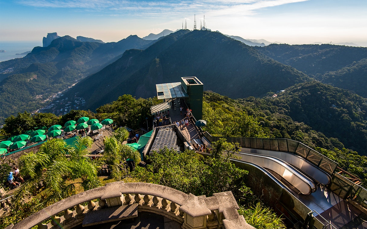 Tijuca Forest mountains view from Corcovado Mountain, green umbrellas, staircase to Christ the Redeemer.