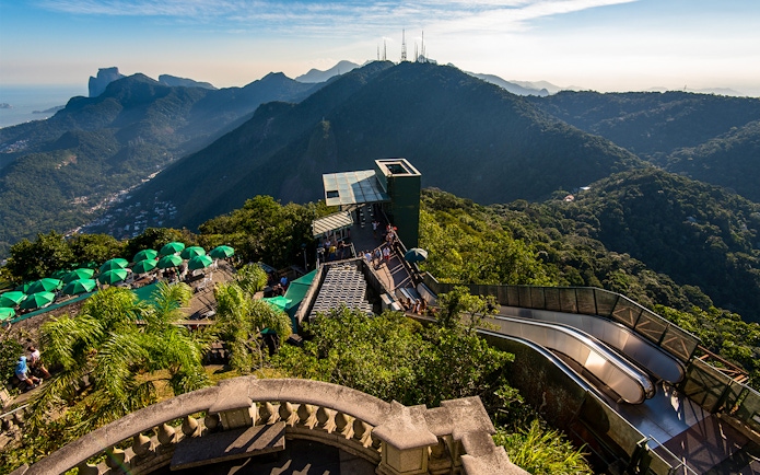 Tijuca Forest mountains view from Corcovado Mountain, green umbrellas, staircase to Christ the Redeemer.