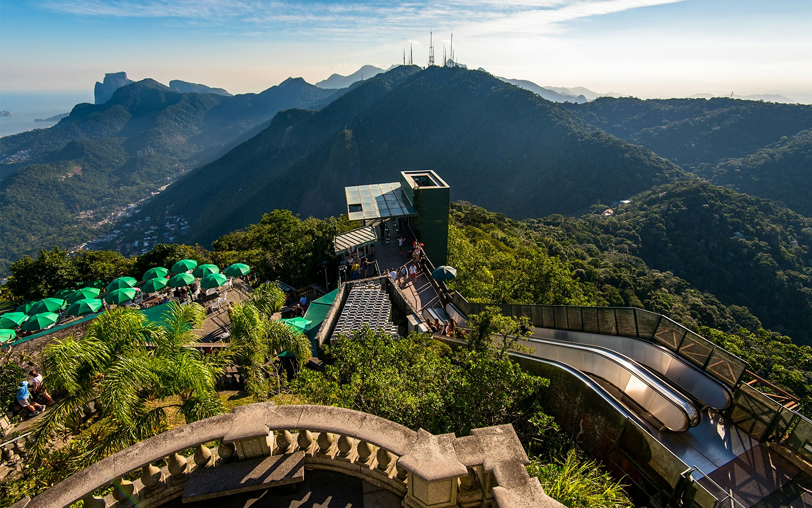 Tijuca Forest mountains view from Corcovado Mountain, green umbrellas, staircase to Christ the Redeemer.