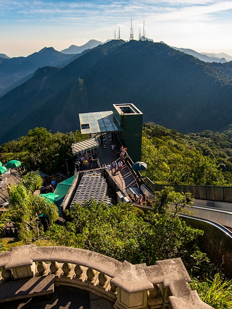 Tijuca Forest mountains view from Corcovado Mountain, green umbrellas, staircase to Christ the Redeemer.
