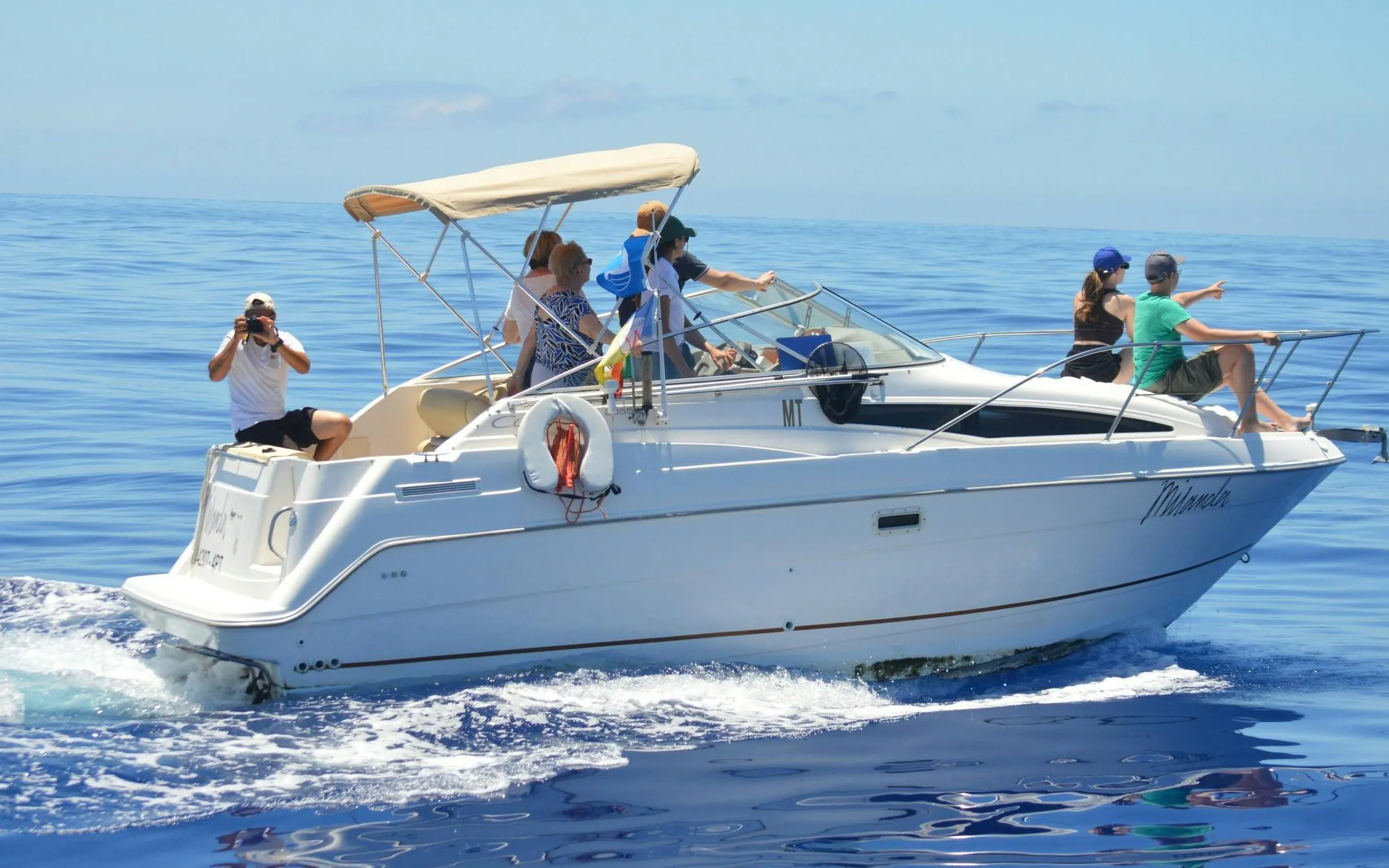 Tourists on a boat during Private Luxury Dolphin & Whale Watching in Madeira.
