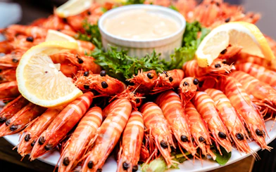 Prawns with lemon slices and sauce on Darwin Harbour Sunset Dinner Cruise.