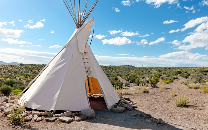 Teepee on desert landscape during Las Vegas to Grand Canyon West tour.