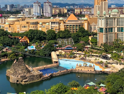 Aerial view of Sunway Lagoon theme park in Malaysia with water attractions and surrounding cityscape.