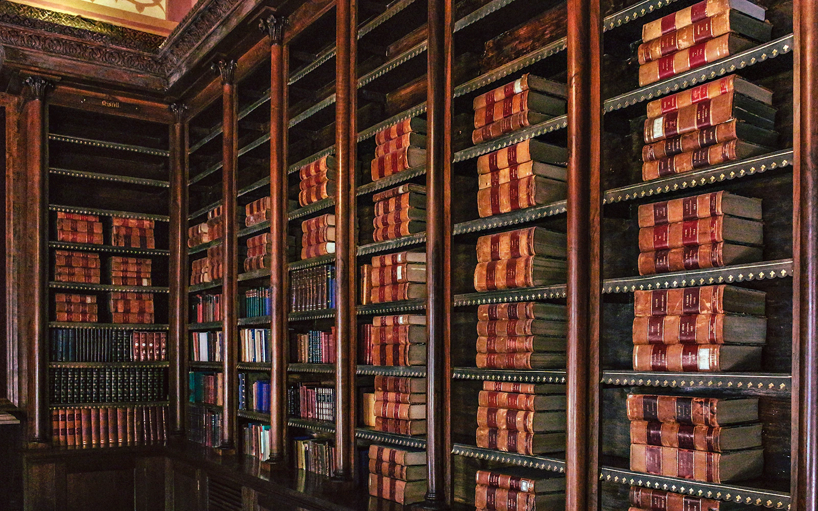 Library shelves filled with books at Monserrate Palace, Sintra.