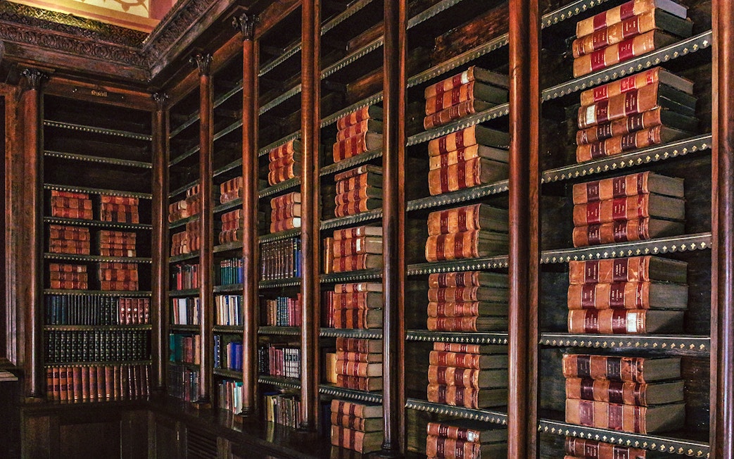 Library shelves filled with books at Monserrate Palace, Sintra.