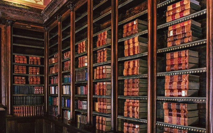 Library shelves filled with books at Monserrate Palace, Sintra.