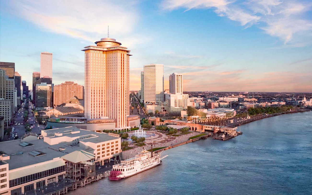 Aerial view of Vue Orleans Observation Deck overlooking New Orleans skyline and Mississippi River.